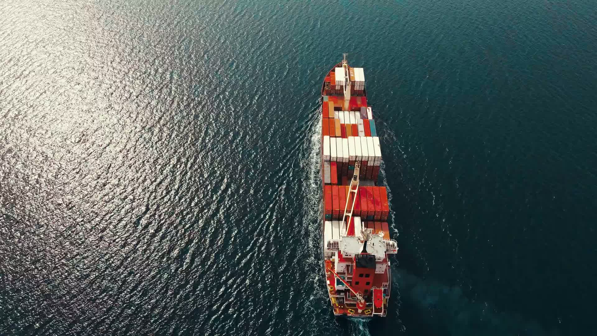 Cargo ship on the sea at the sunset